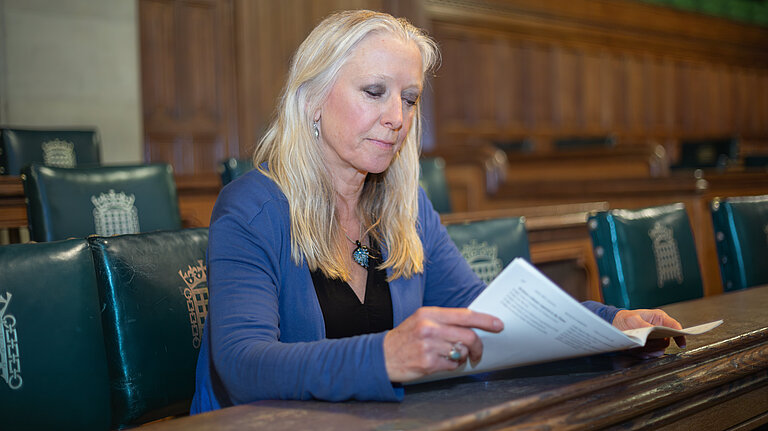 Roz Savage MP looking over important documents in Parliament